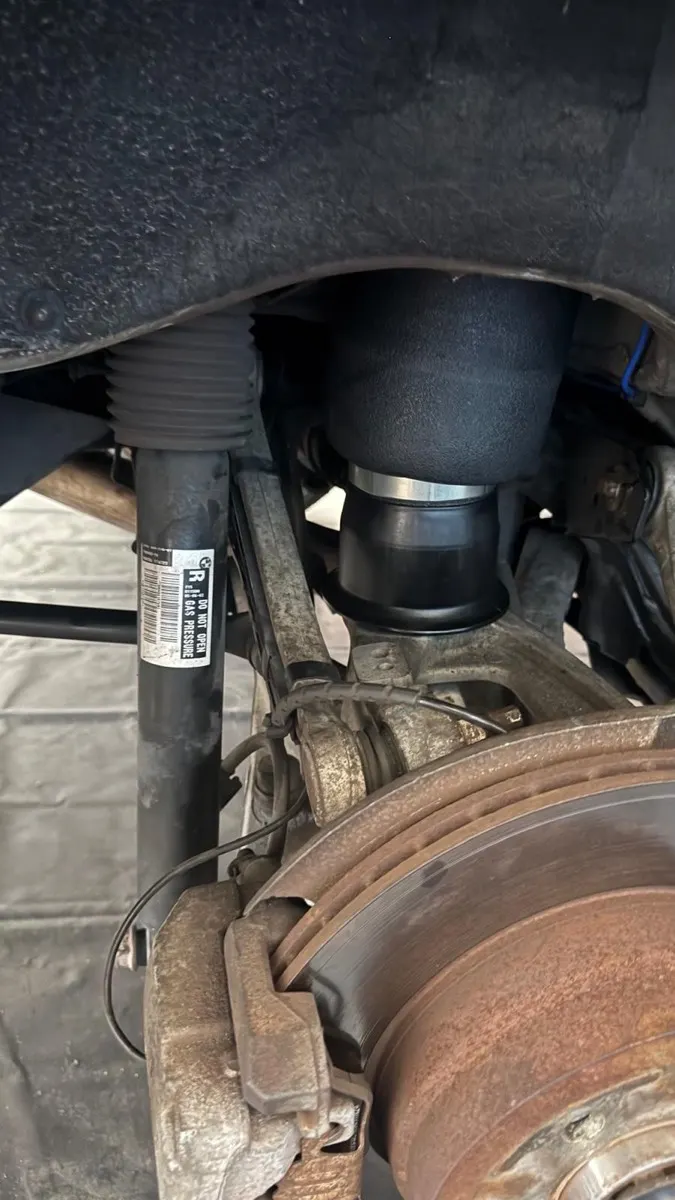 BMW air suspension and brake assembly during repair