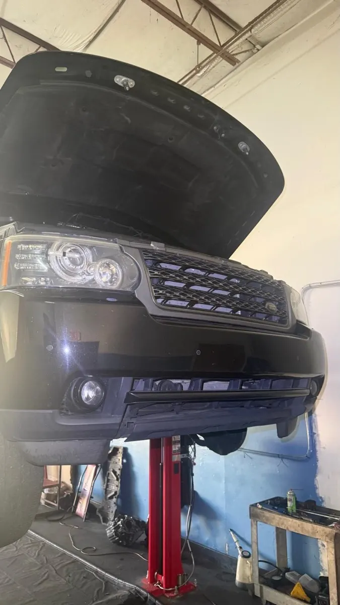 Range Rover with the hood open for service