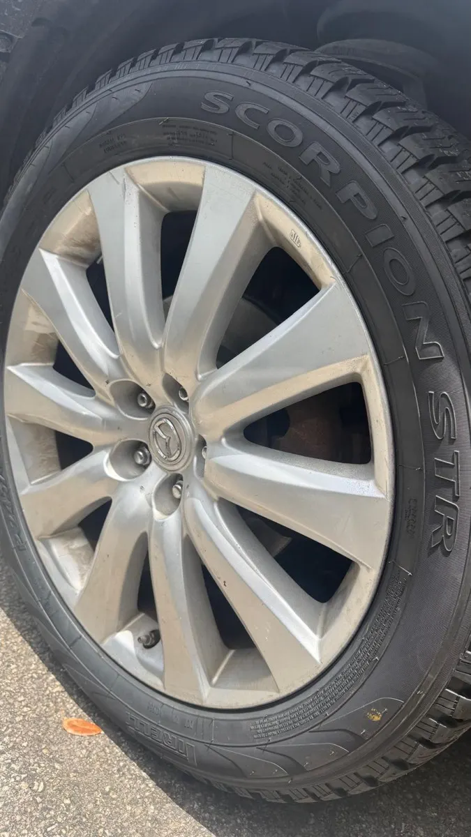 Close-up of a tire and alloy wheel during tire service