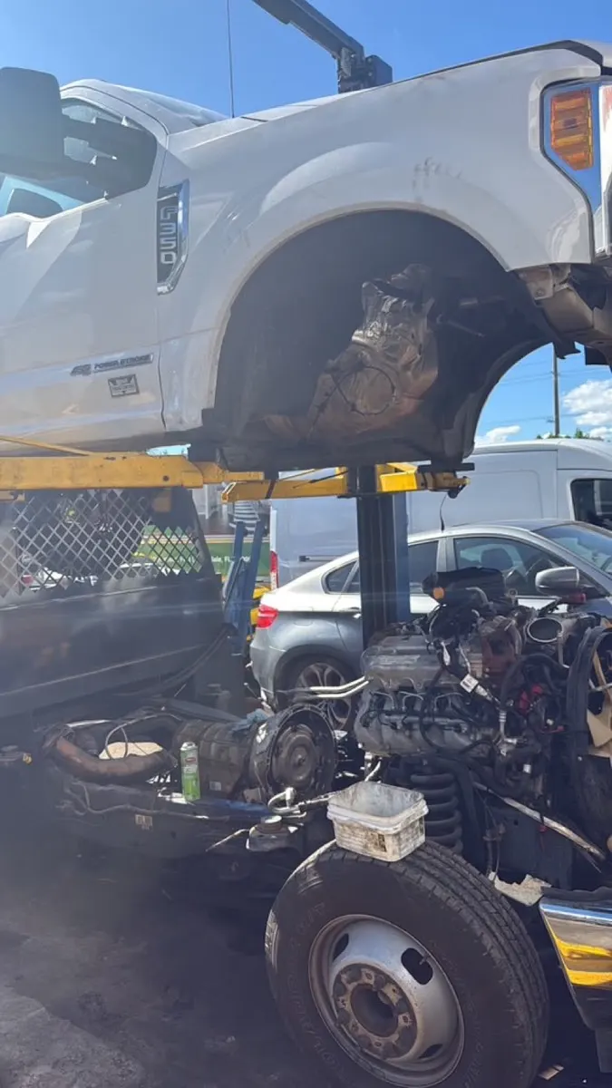 Ford F-350 diesel truck raised on the lift for service